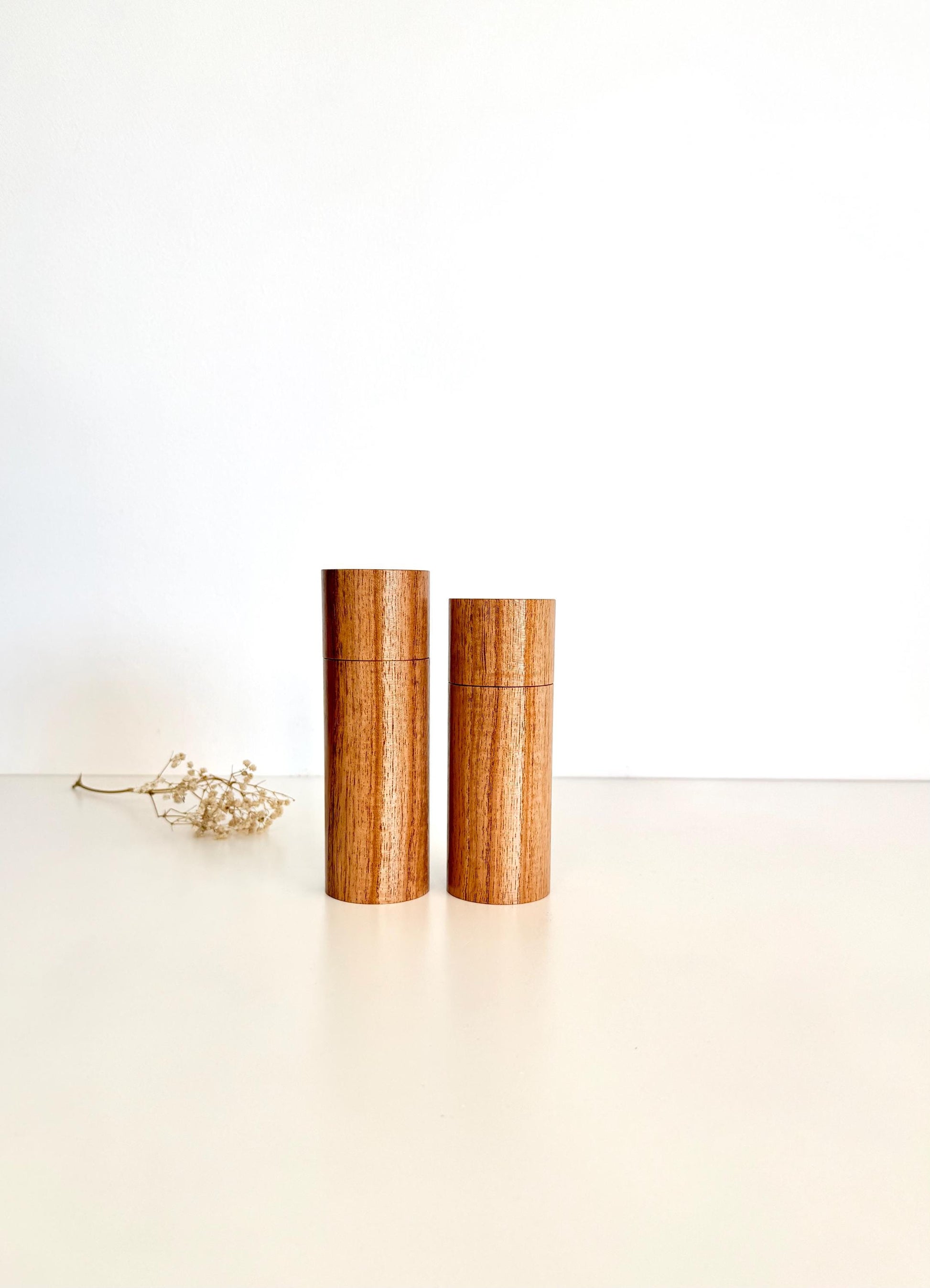 Wooden cylindrical shape salt and pepper grinders made from Cape Lilac timber