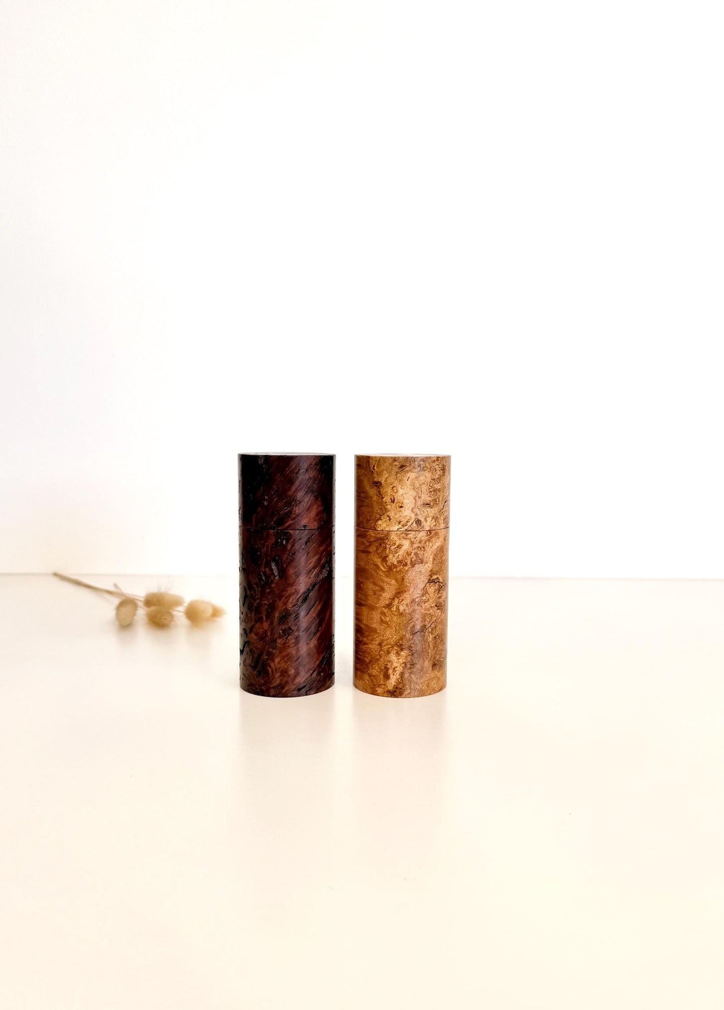Wooden cylindrical shape salt and pepper grinders made from Jarrah burl and Sugar gum timbers