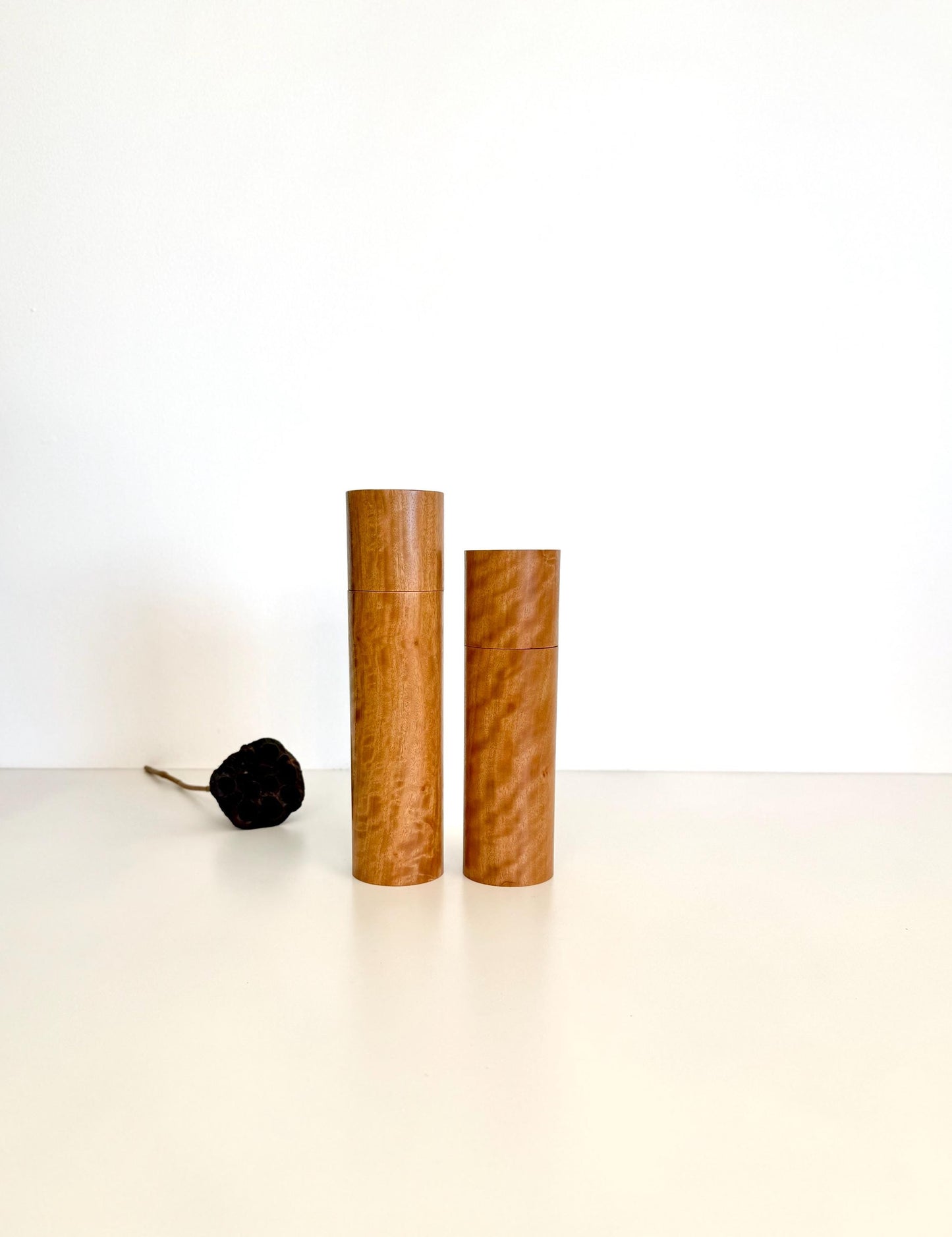 Wooden cylindrical shape salt and pepper grinders made from blackbutt timber
