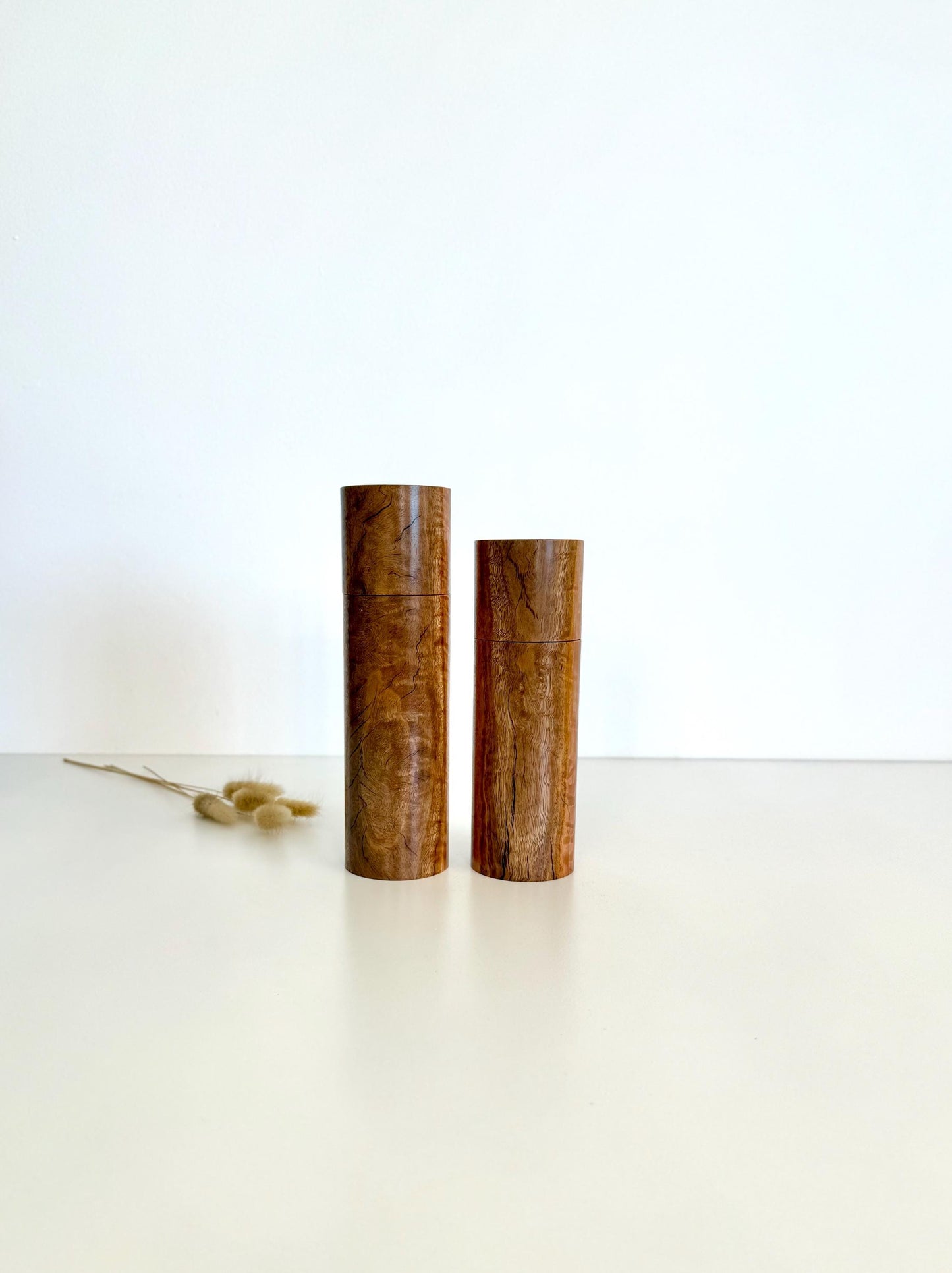 Wooden cylindrical shape salt and pepper grinders made from river red gum timber