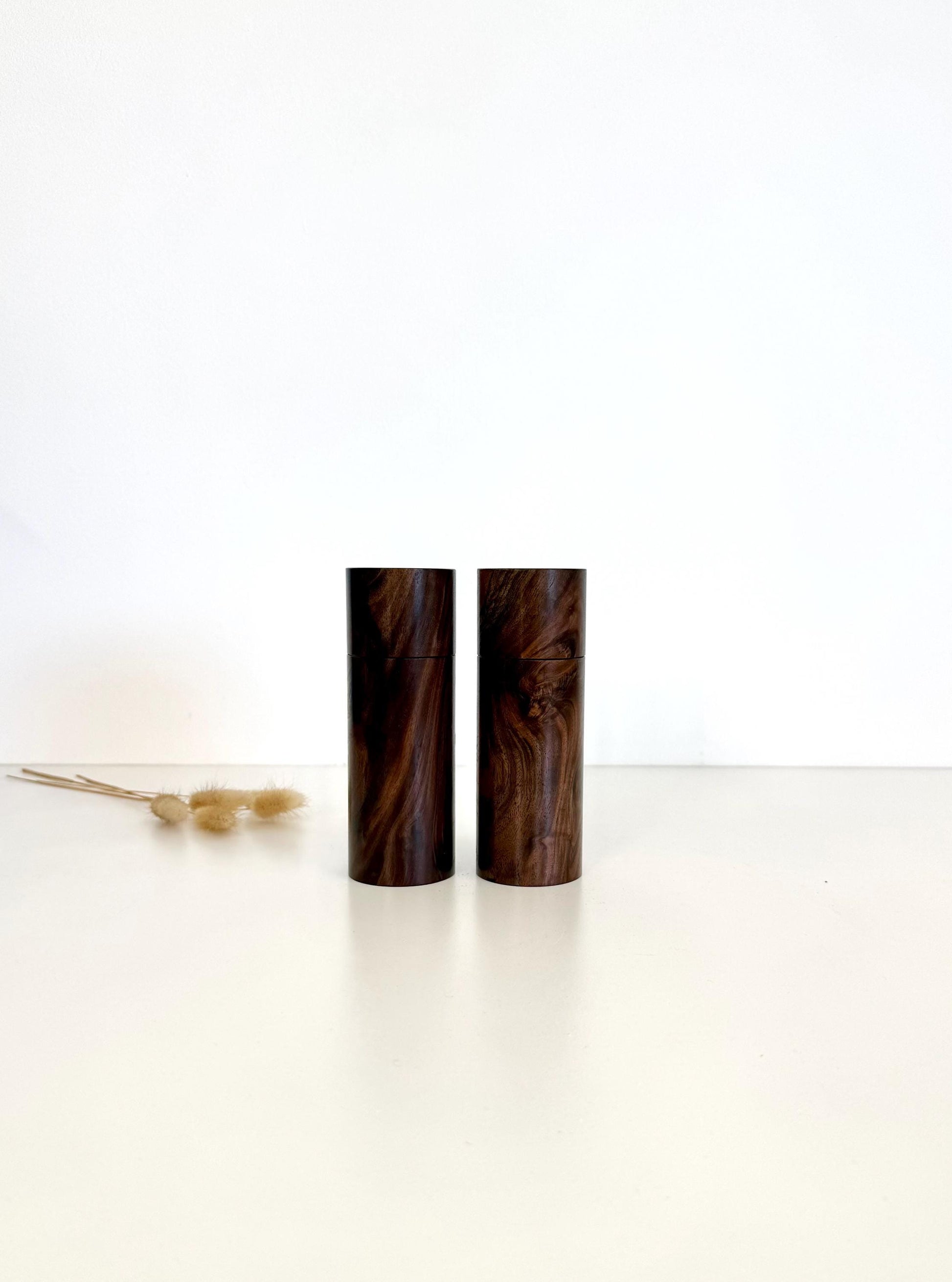 Wooden cylindrical shape salt and pepper grinders made from Black Walnut timber.