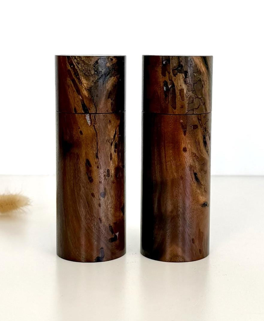 Wooden cylindrical shape salt and pepper grinders made from Black Walnut timber.