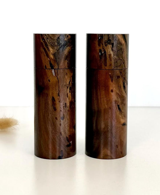 Wooden cylindrical shape salt and pepper grinders made from Black Walnut timber.