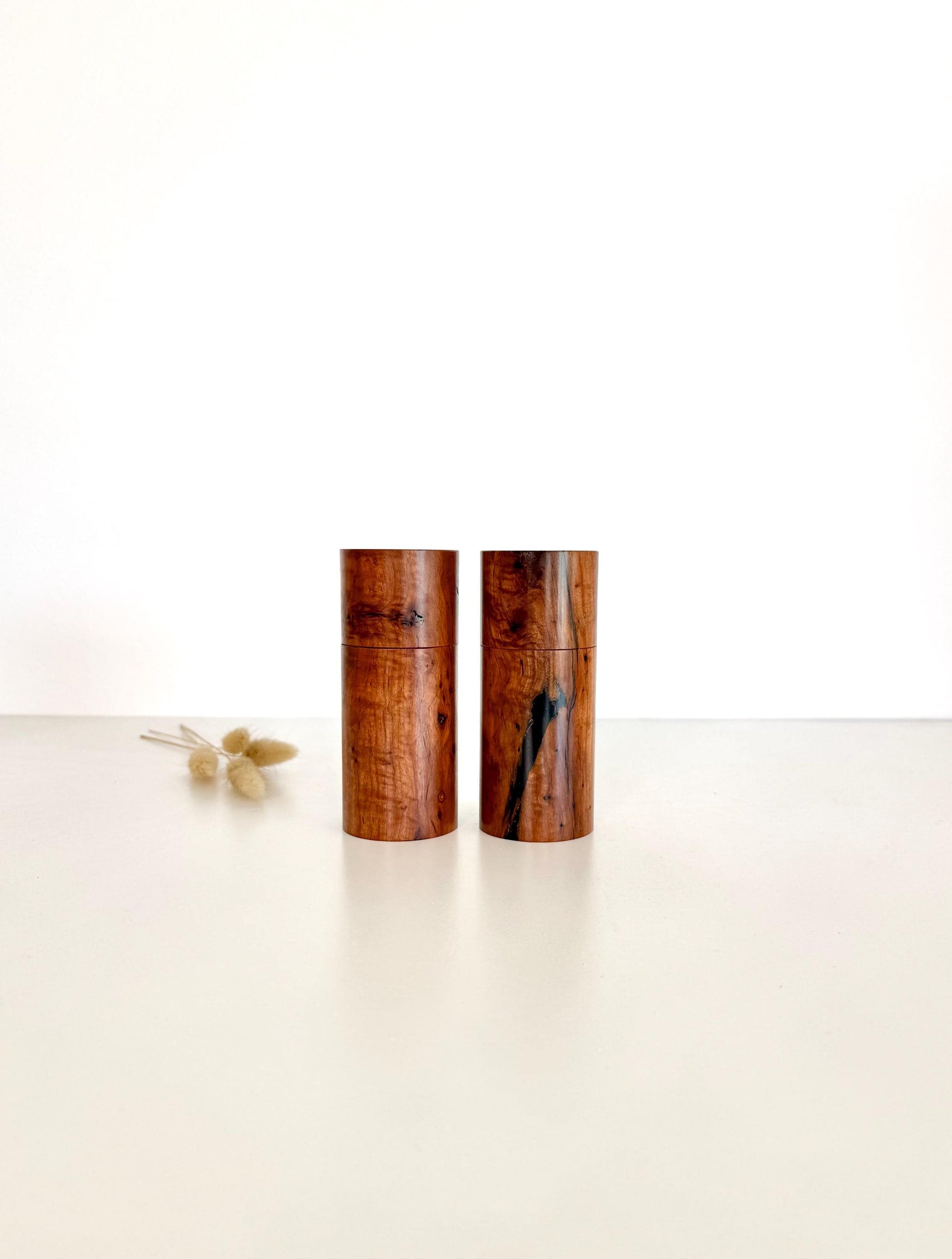 Wooden cylindrical shape salt and pepper grinders made from Mallee timber