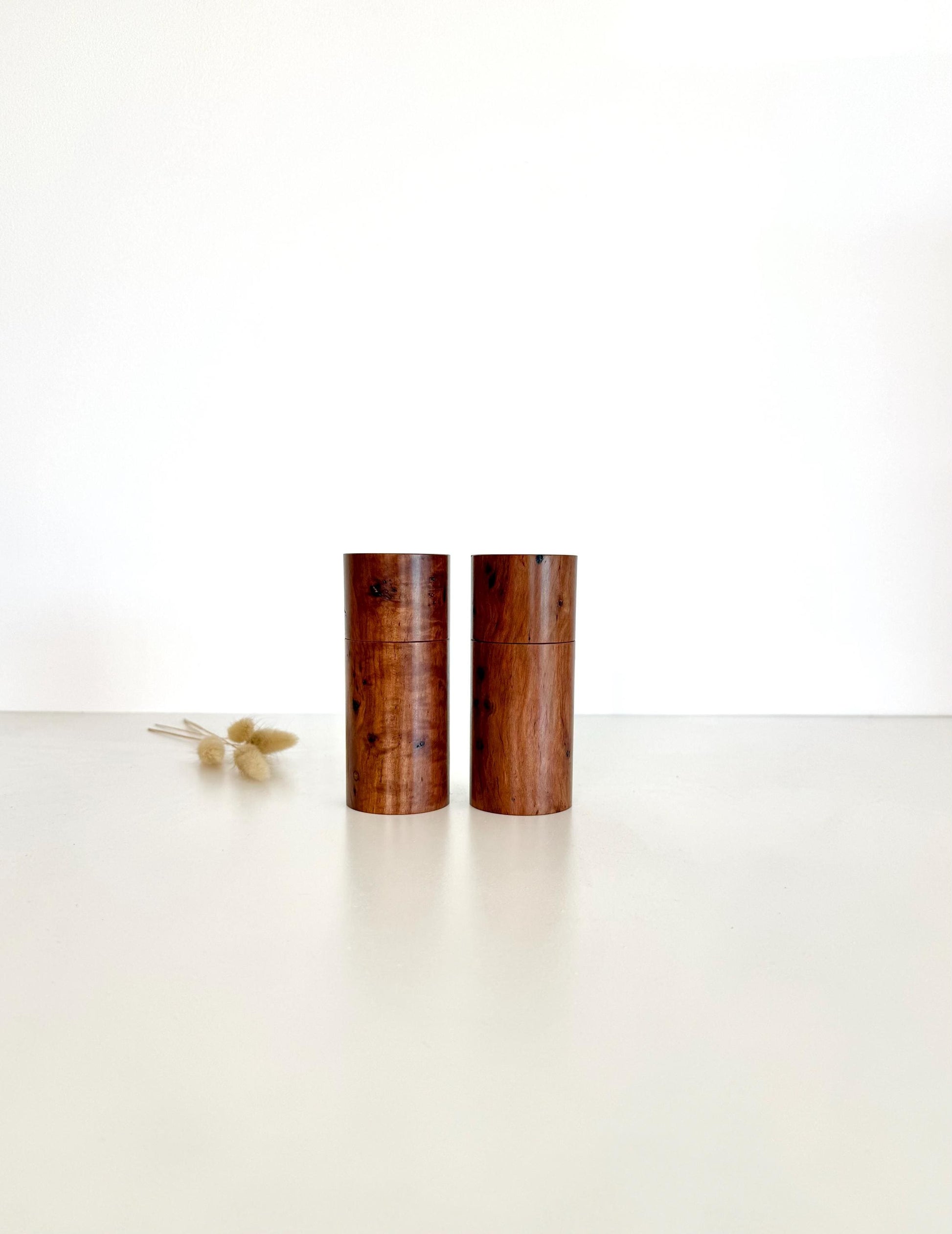 Wooden cylindrical shape salt and pepper grinders made from Mallee timber