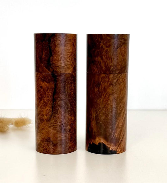 Wooden cylindrical shape salt and pepper grinders made from Blackbutt burl timber.