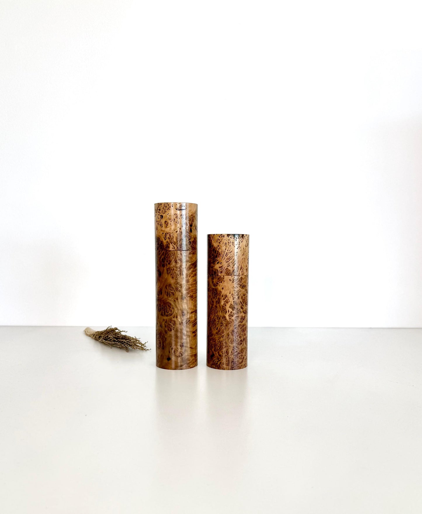 Wooden cylindrical shape salt and pepper grinders made from York Gum Burl timber