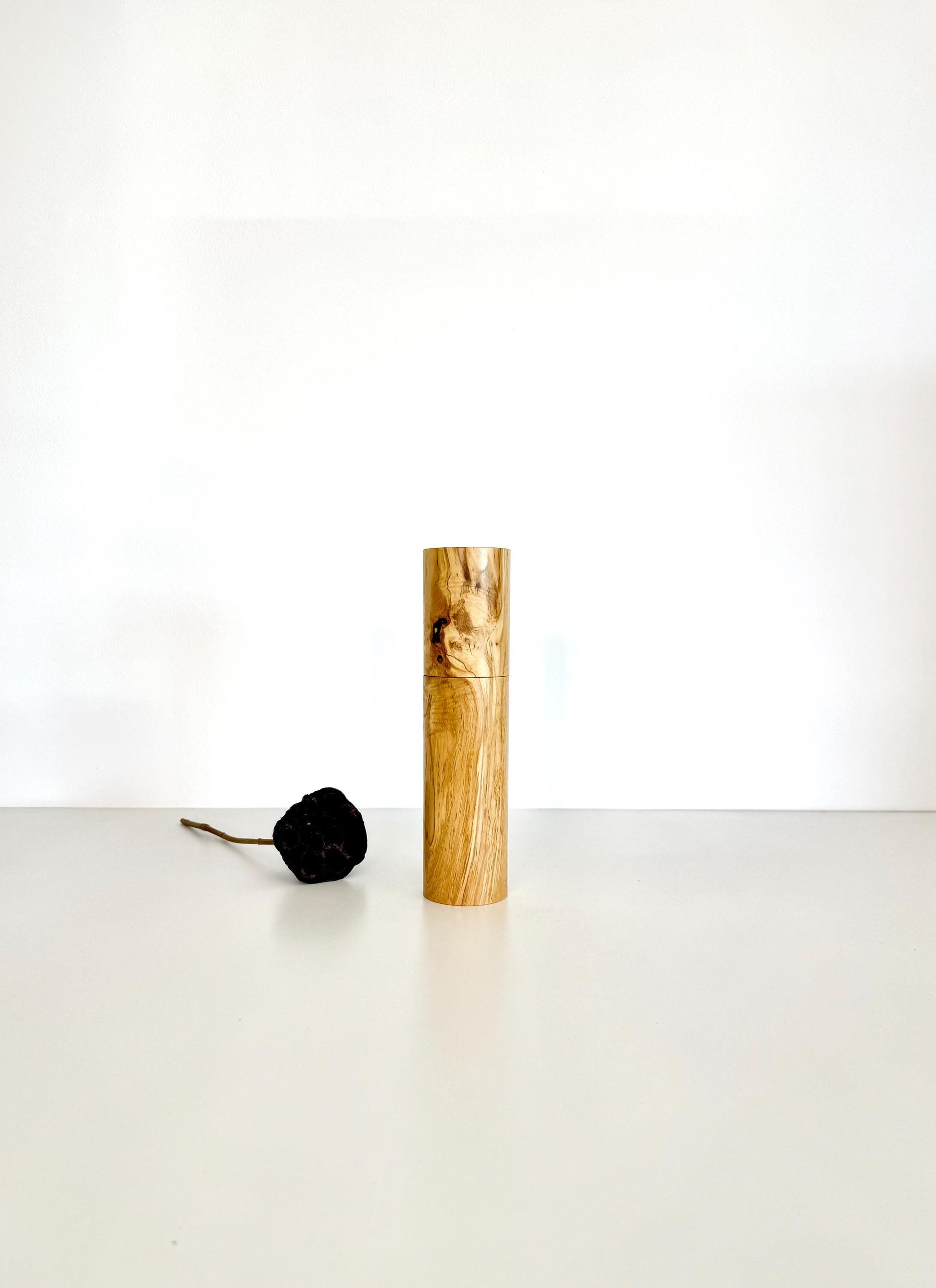 Wooden cylindrical shape salt and pepper grinder made from Olive timber