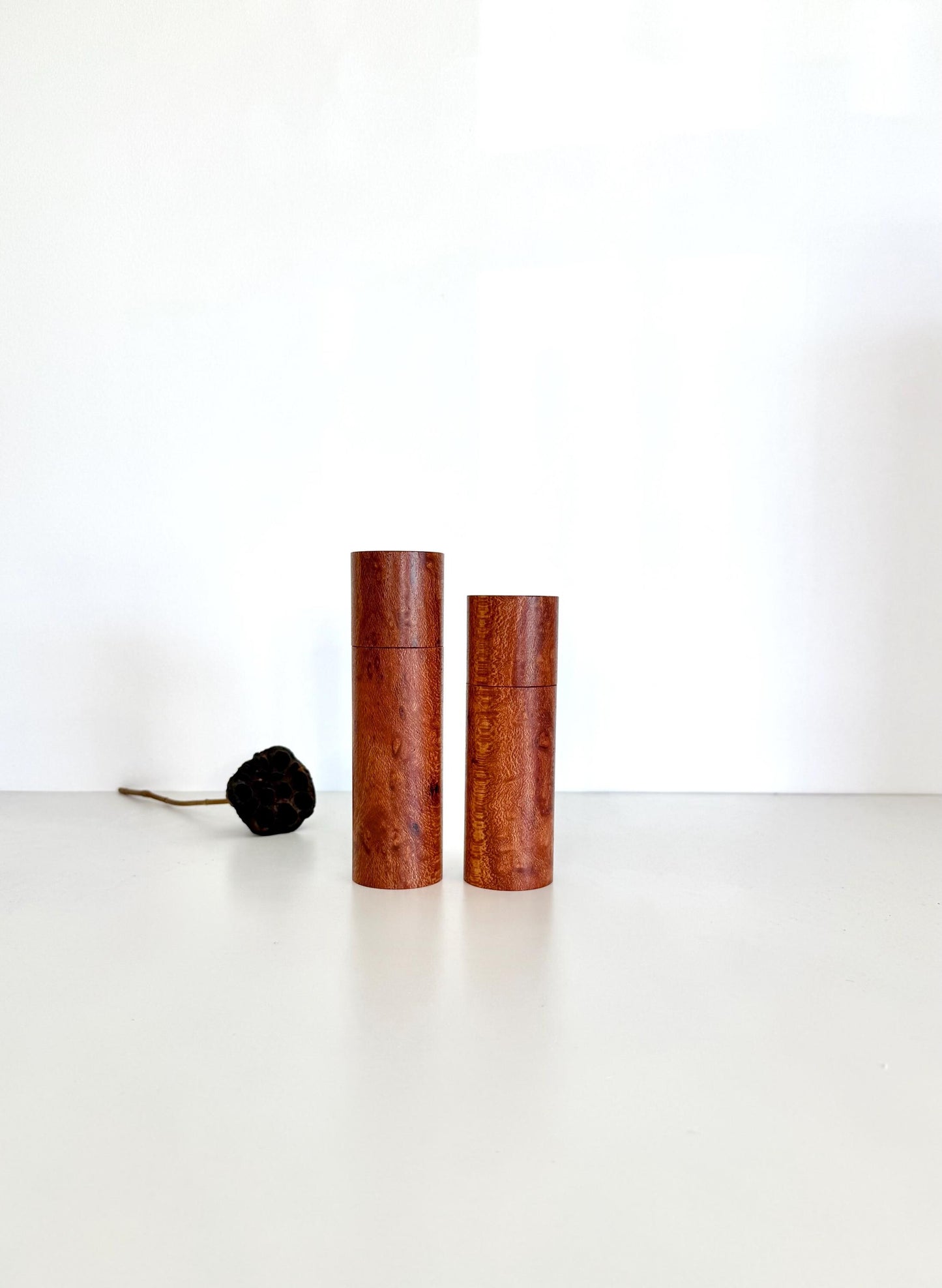 Wooden cylindrical shape salt and pepper grinders made from Banksia timber