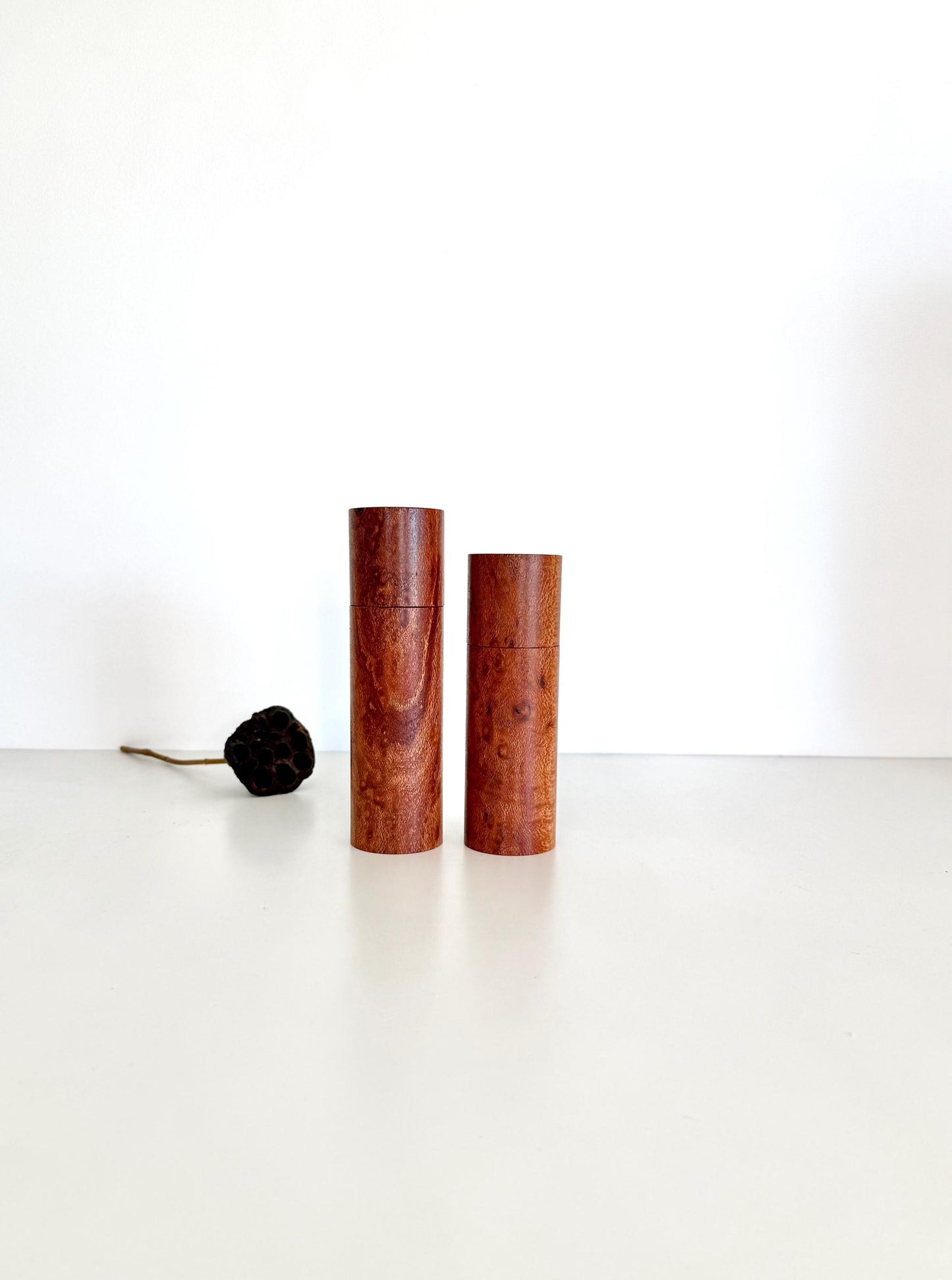 Wooden cylindrical shape salt and pepper grinders made from Banksia timber