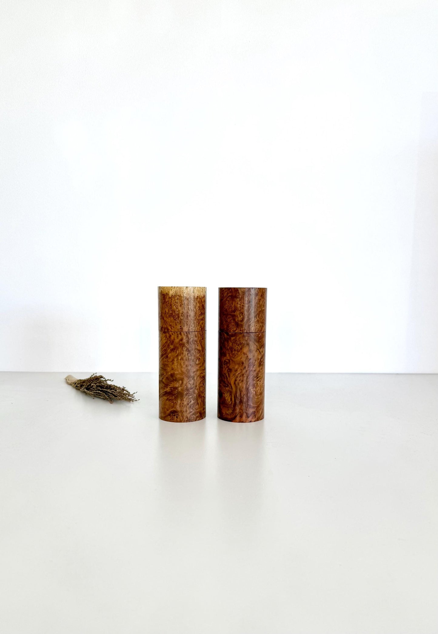 Wooden cylindrical shape salt and pepper grinders made from Rib Fruited Mallee timber