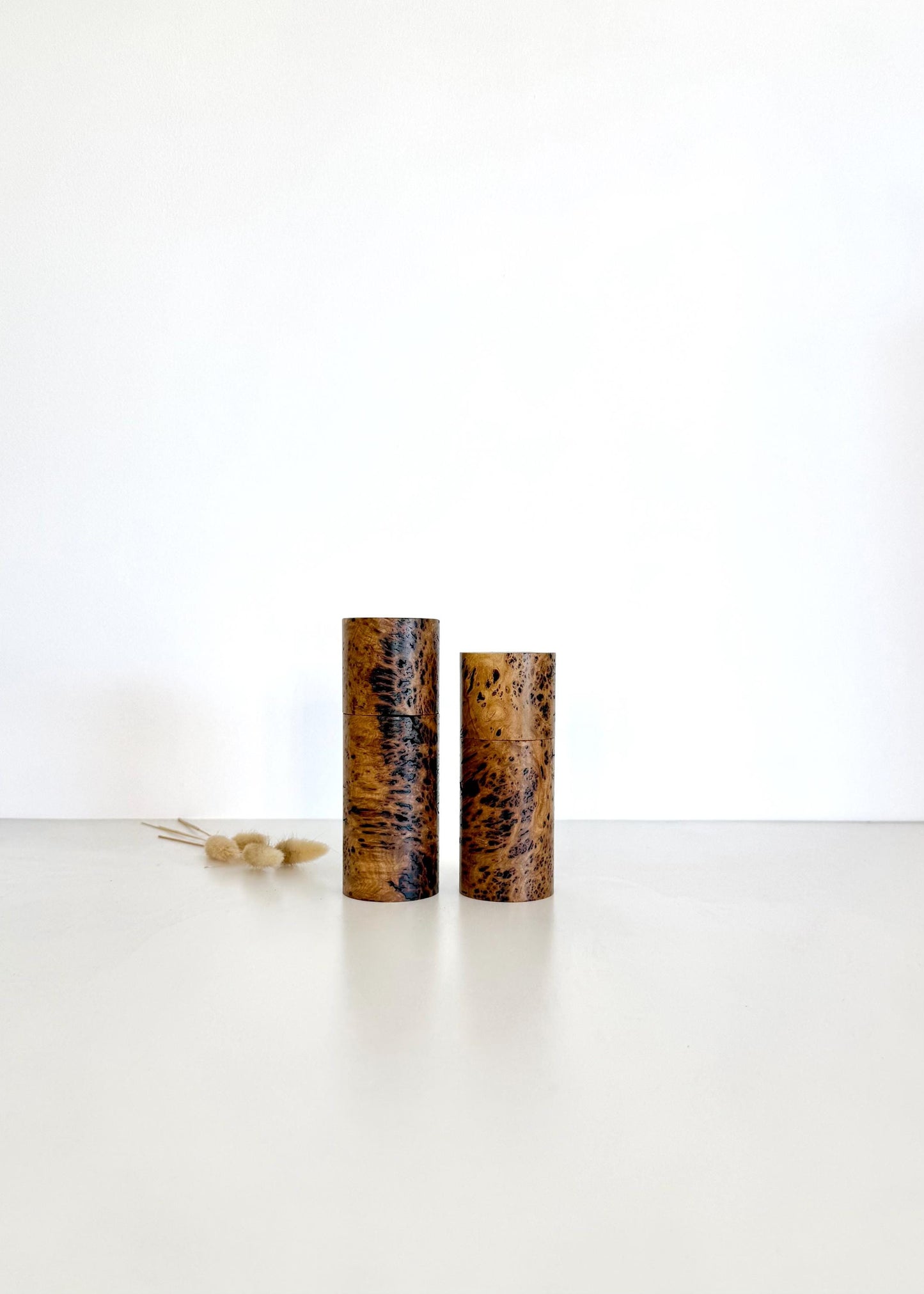 Wooden cylindrical shape salt and pepper grinders made from Rib Fruited Mallee timber