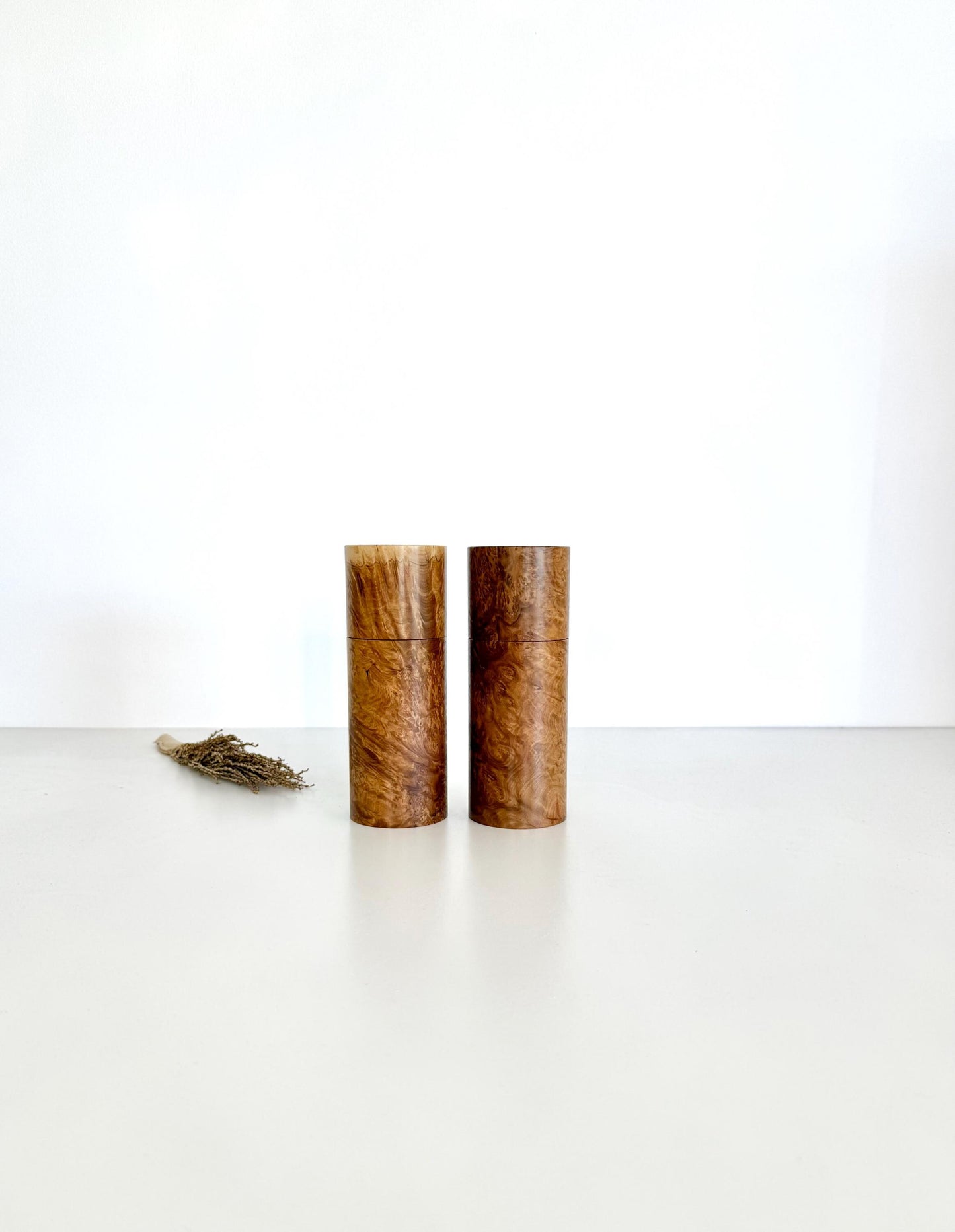 Wooden cylindrical shape salt and pepper grinders made from Rib Fruited Mallee timber