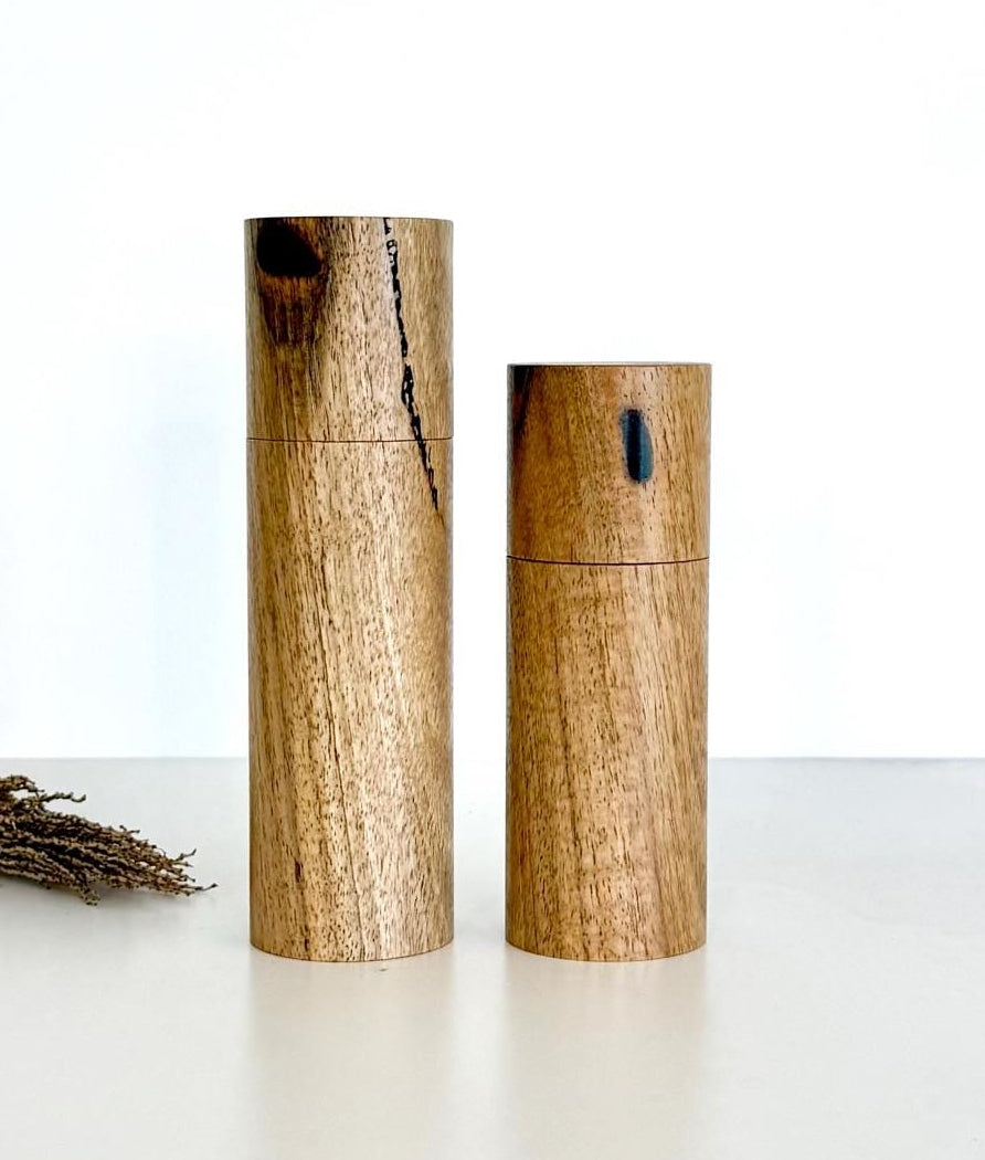 Wooden cylindrical shape salt and pepper grinders made from Marri timber.