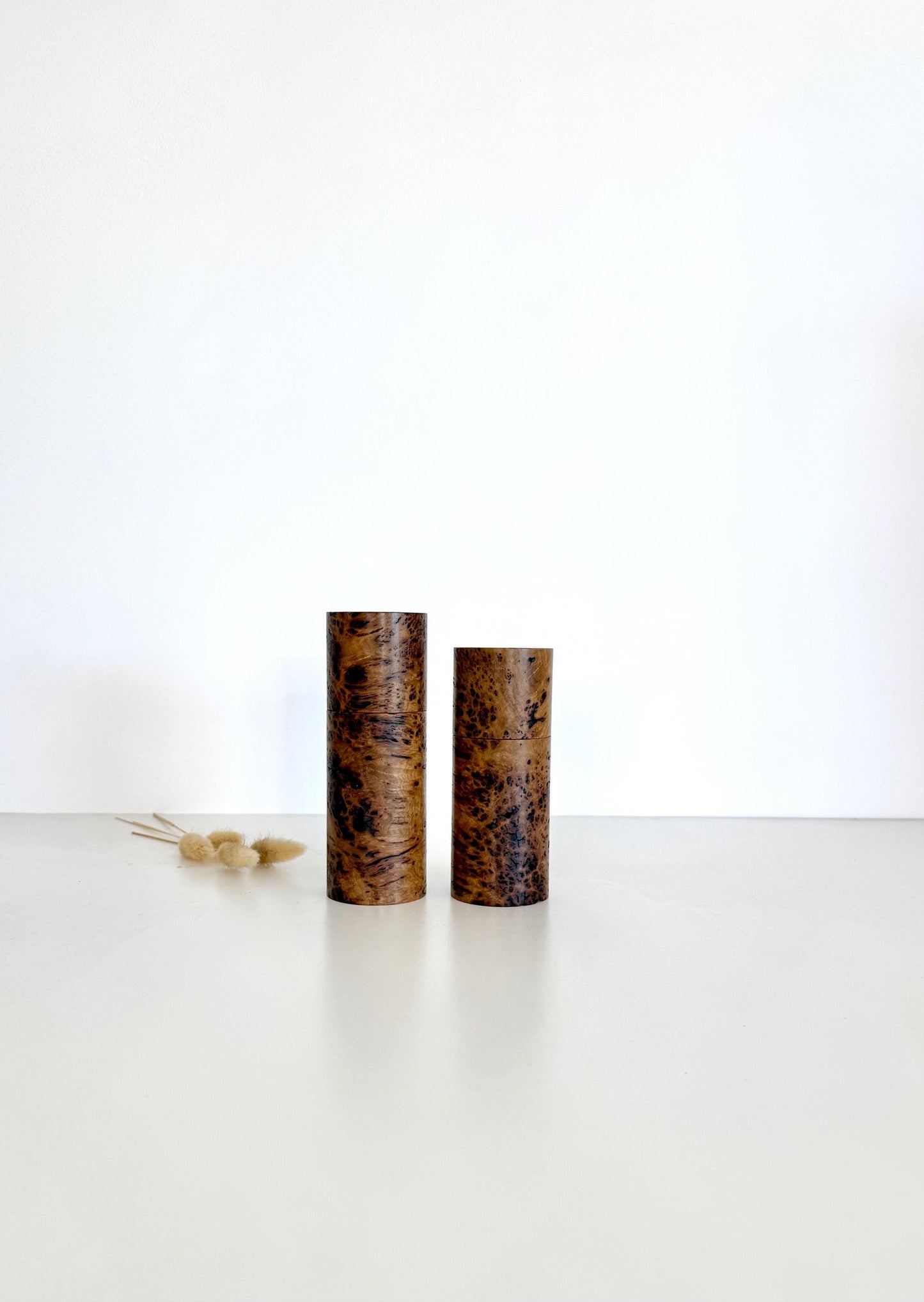 Wooden cylindrical shape salt and pepper grinders made from Rib Fruited Mallee timber