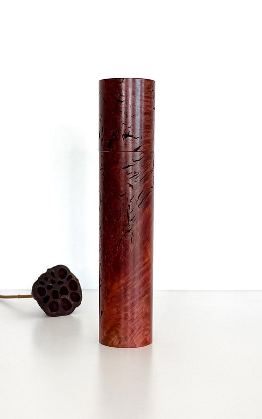 Wooden cylindrical shape salt and pepper grinder made from Jarrah Burl timber