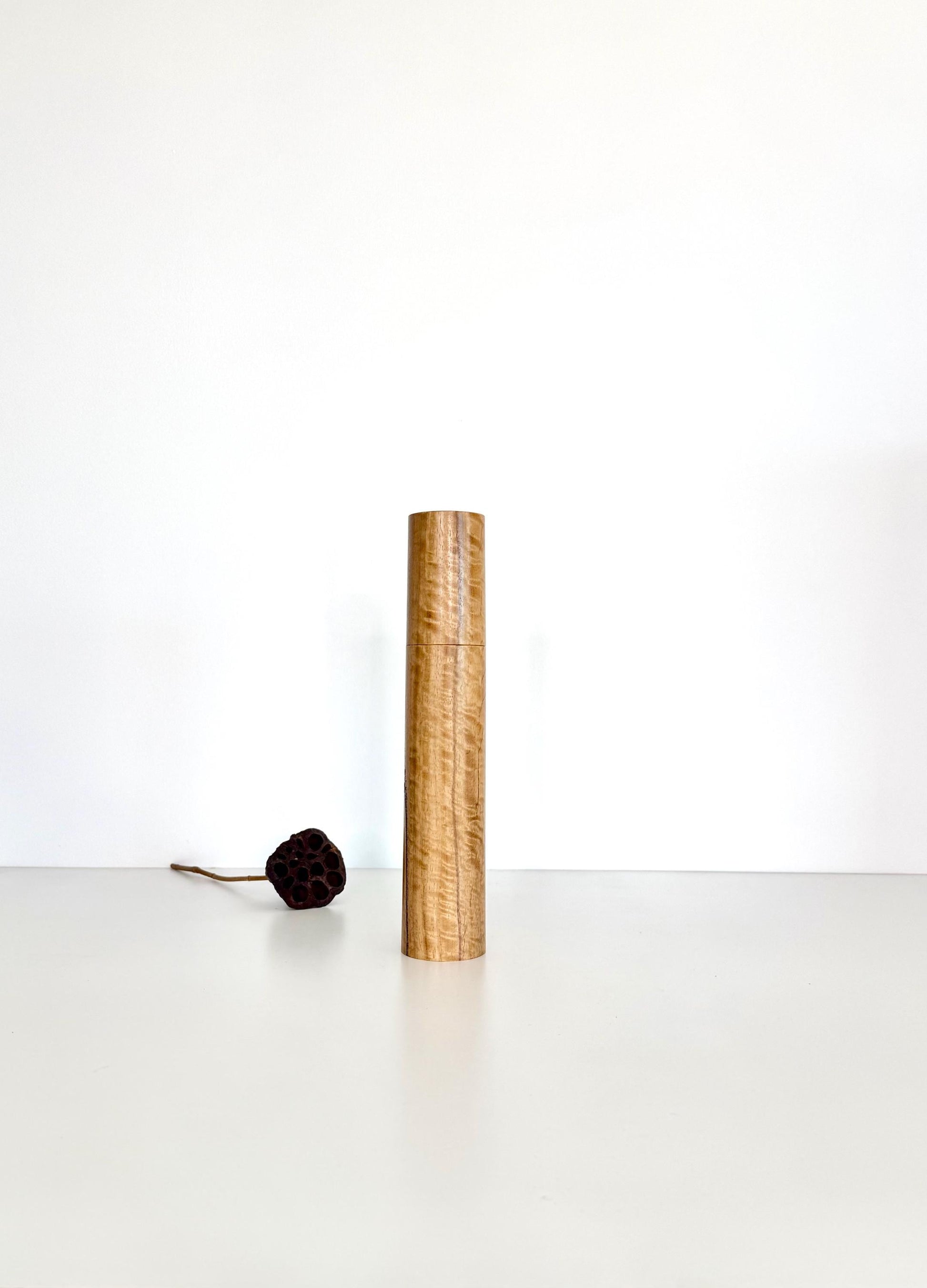 Wooden cylindrical shape salt and pepper grinder made from Curly Marri timber