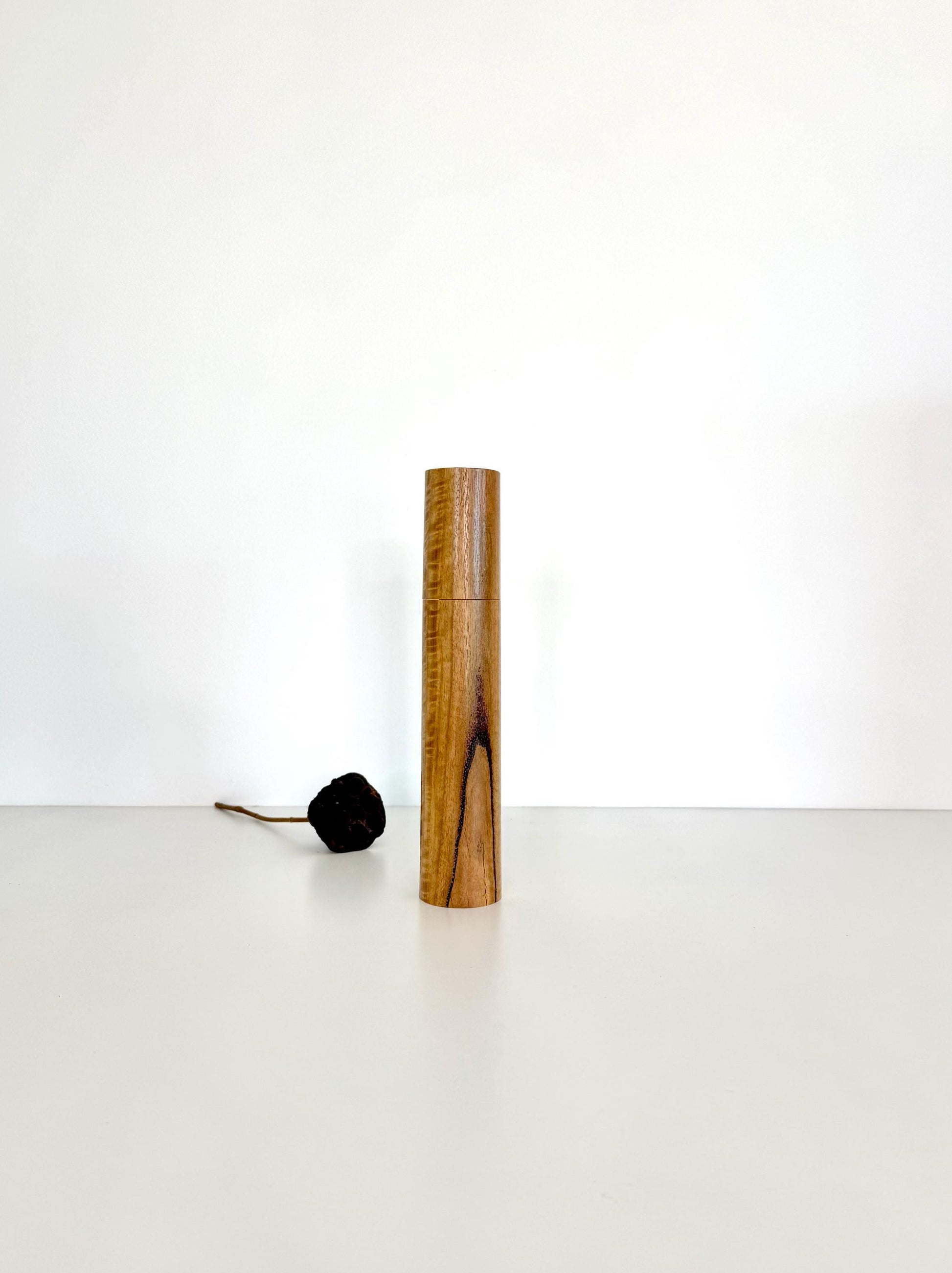 Wooden cylindrical shape salt and pepper grinder made from Curly Marri timber