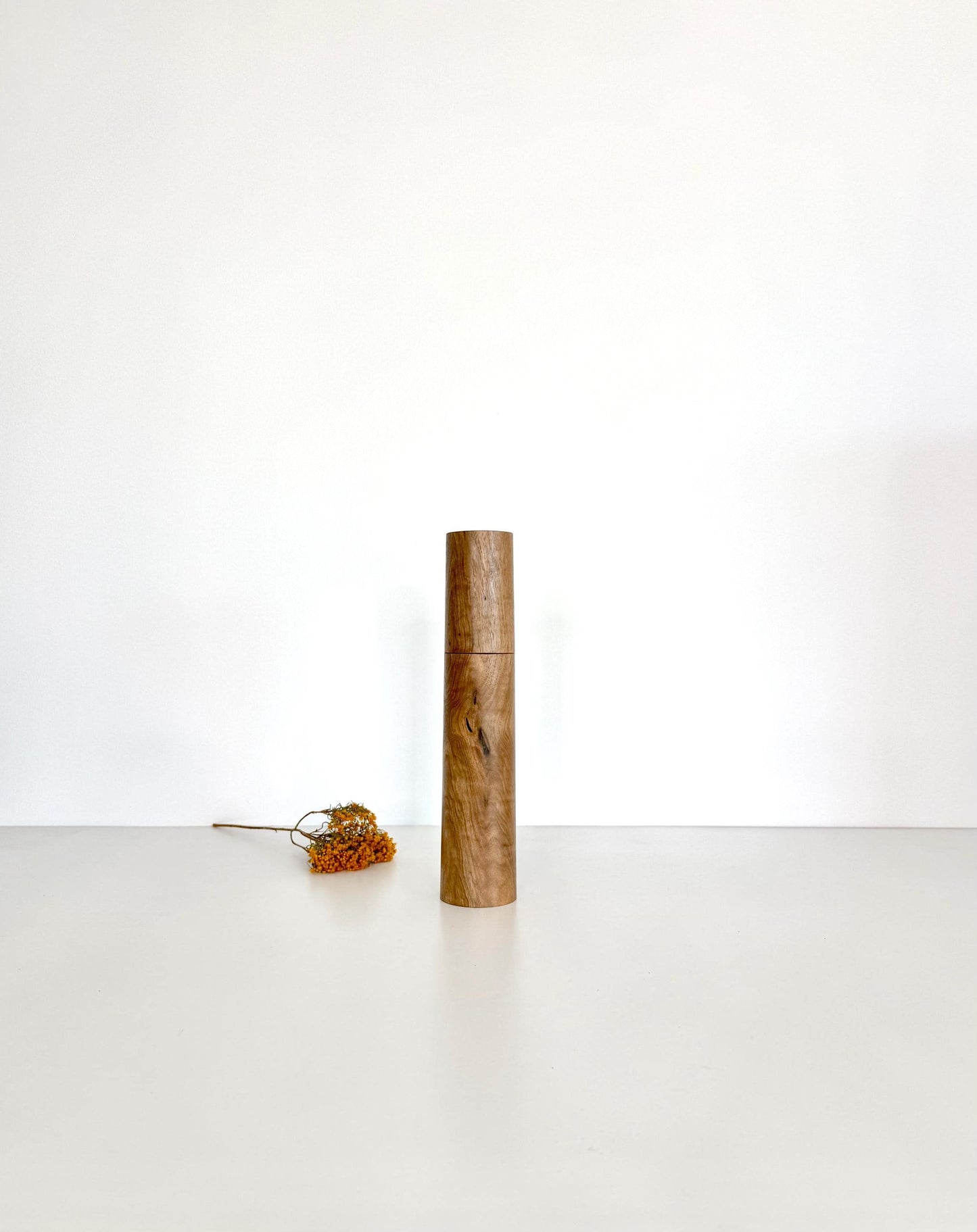 Wooden cylindrical shape salt and pepper grinder made from Walnut timber