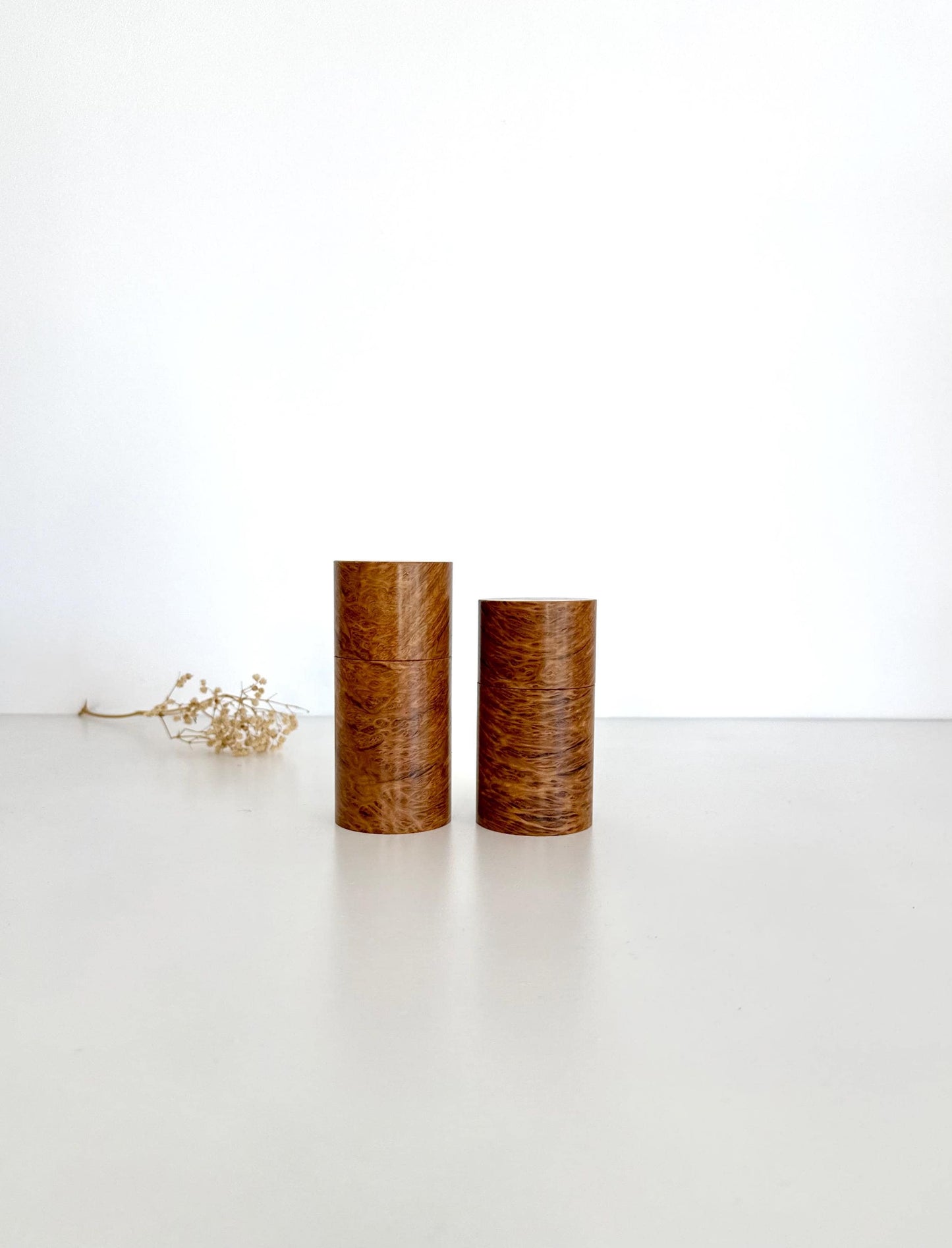 Wooden cylindrical shape salt and pepper grinders made from Bimble Box Burl timber.