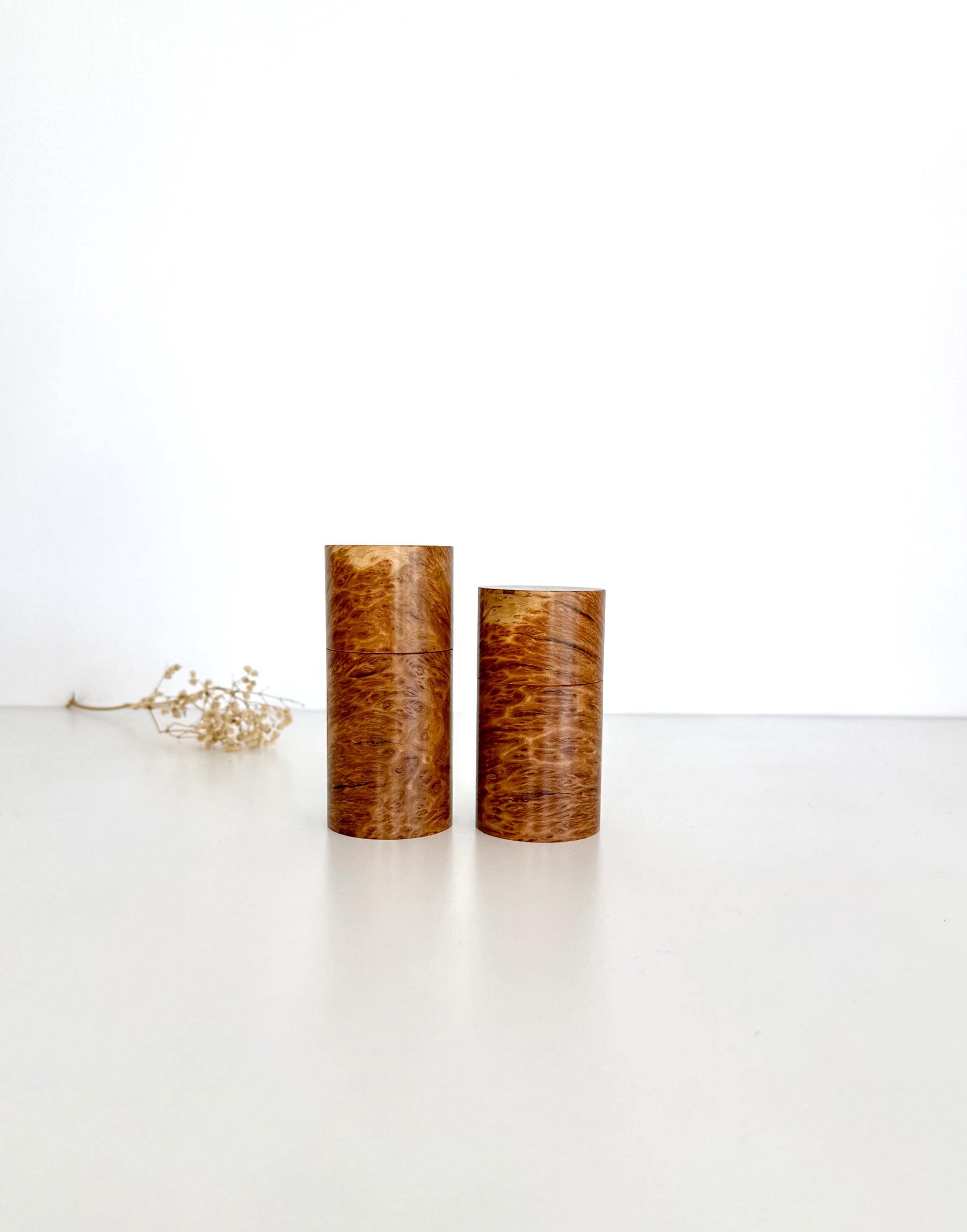 Wooden cylindrical shape salt and pepper grinders made from Bimble Box Burl timber.