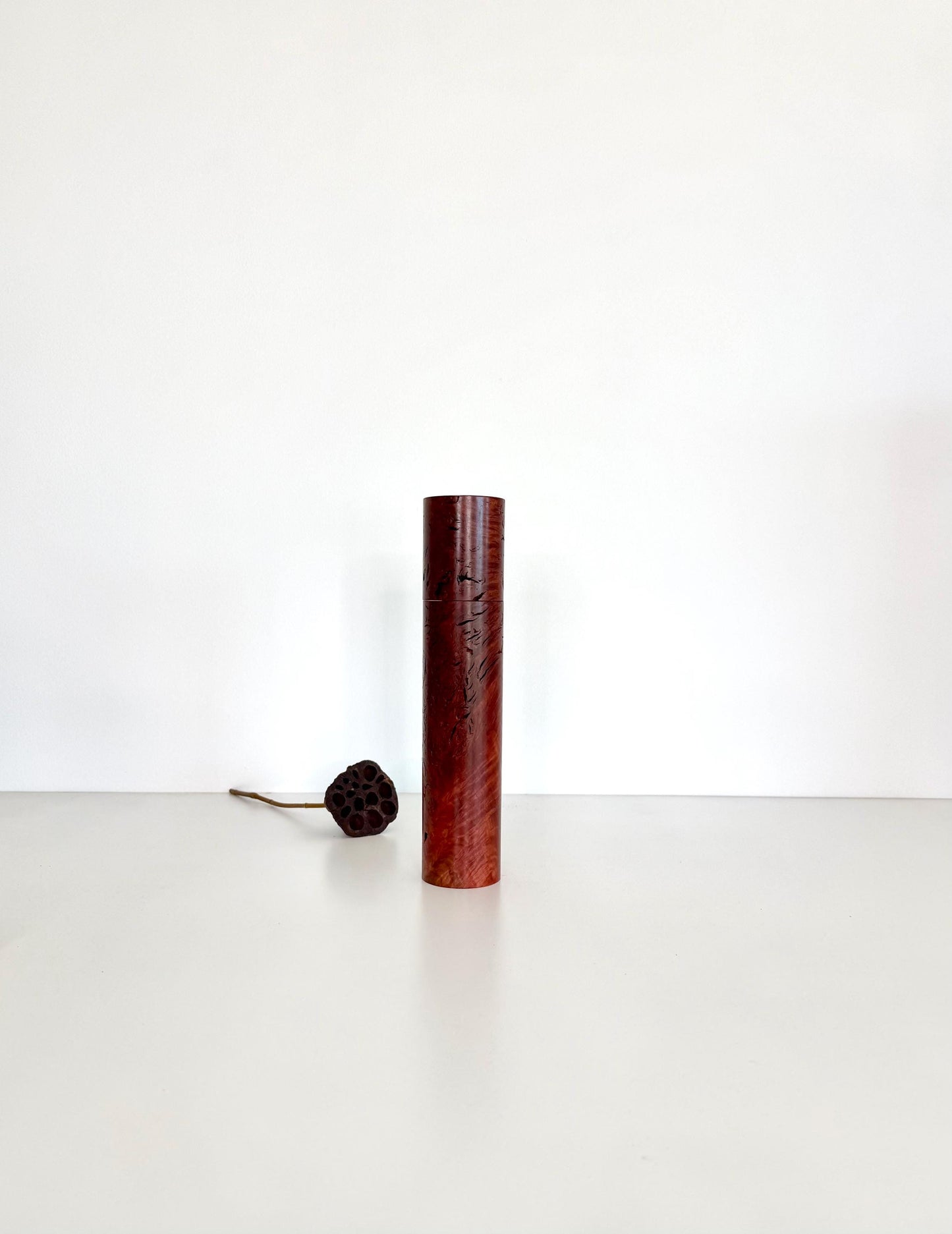 Wooden cylindrical shape salt and pepper grinder made from Jarrah Burl timber