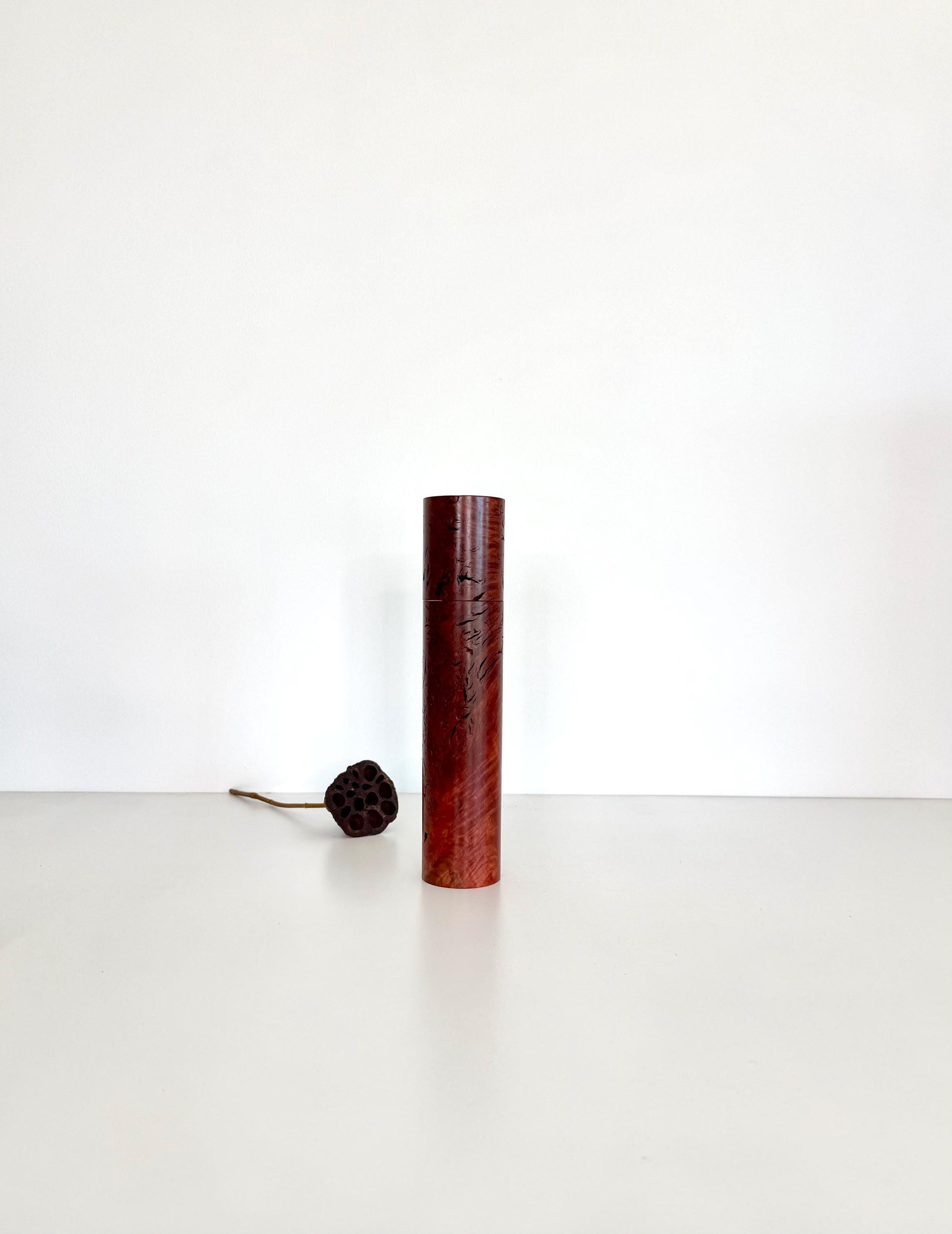Wooden cylindrical shape salt and pepper grinder made from Jarrah Burl timber