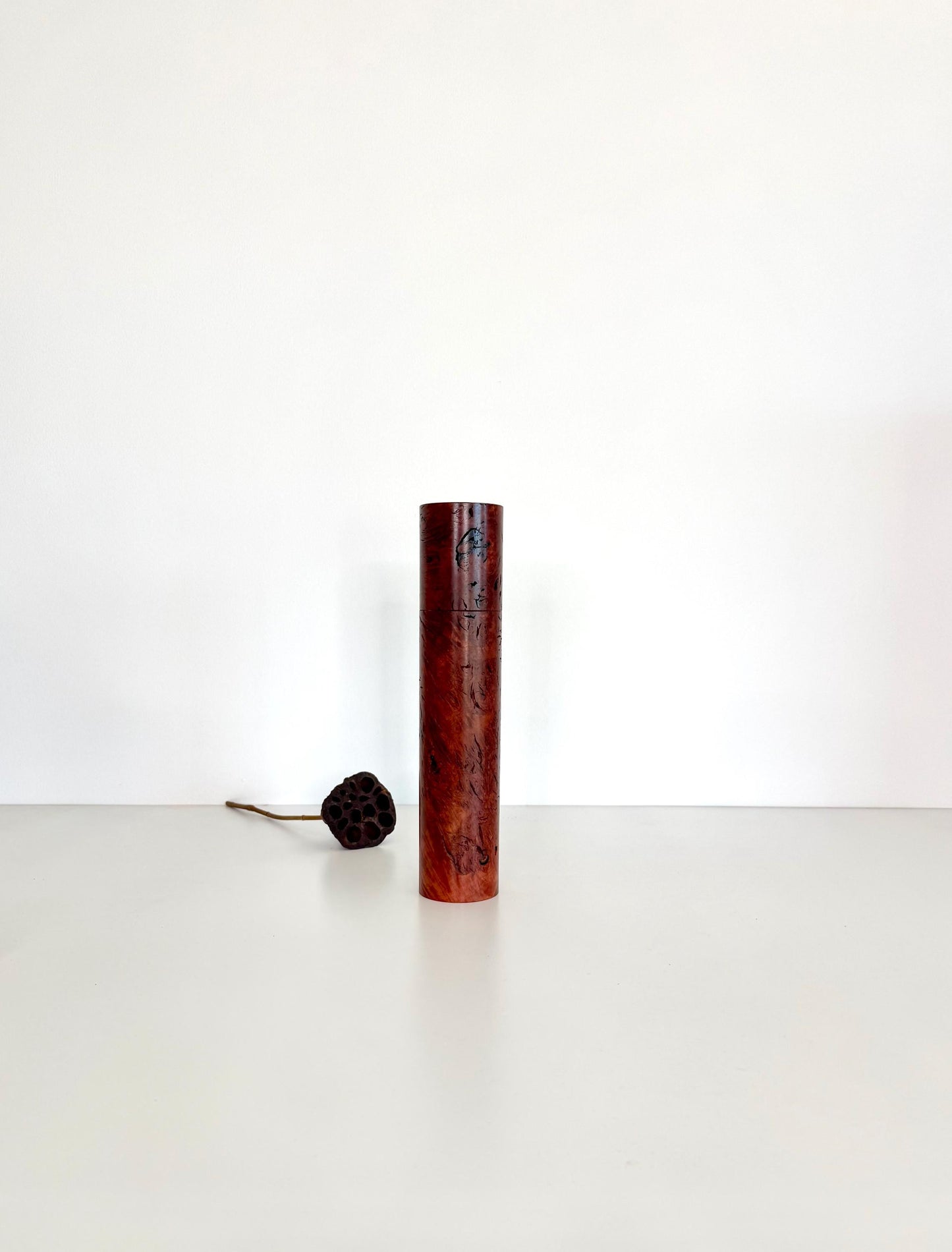 Wooden cylindrical shape salt and pepper grinder made from Jarrah Burl timber