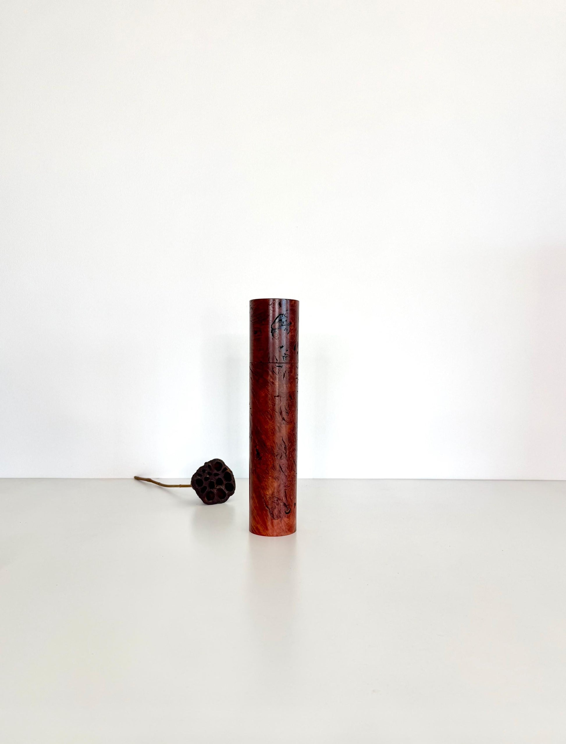 Wooden cylindrical shape salt and pepper grinder made from Jarrah Burl timber