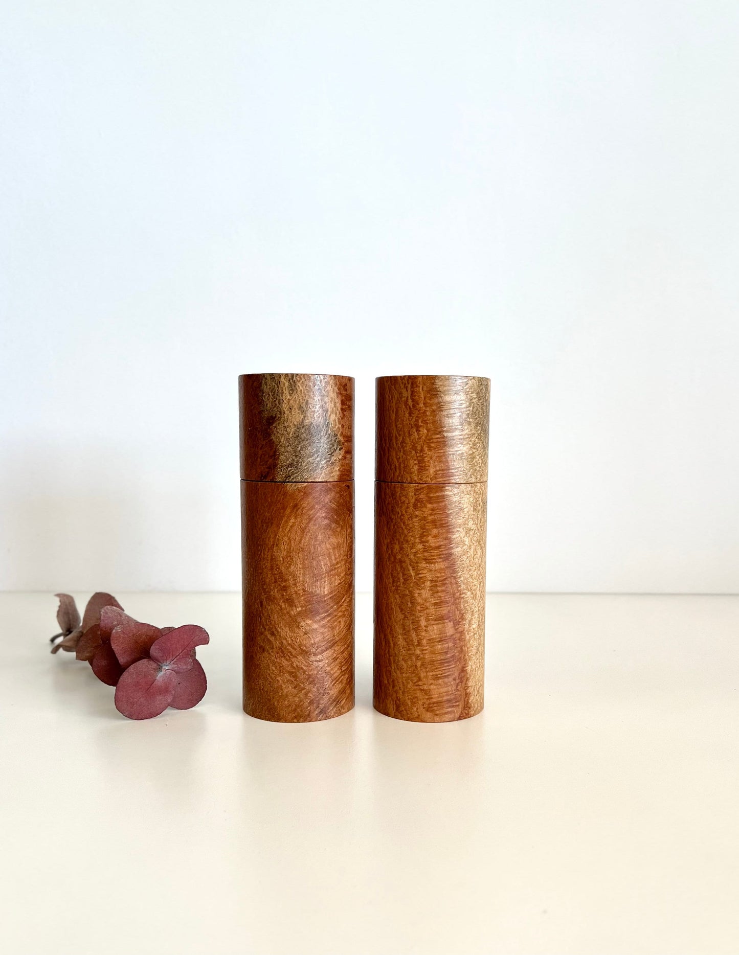 Wooden cylindrical shape salt and pepper grinders made from Australian Snotty Gobble timber