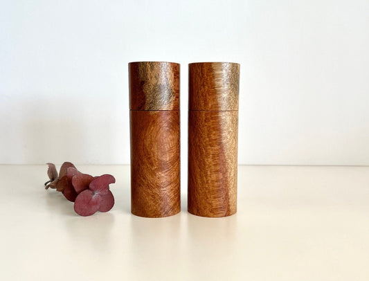 Wooden cylindrical shape salt and pepper grinders made from Australian Snotty Gobble timber