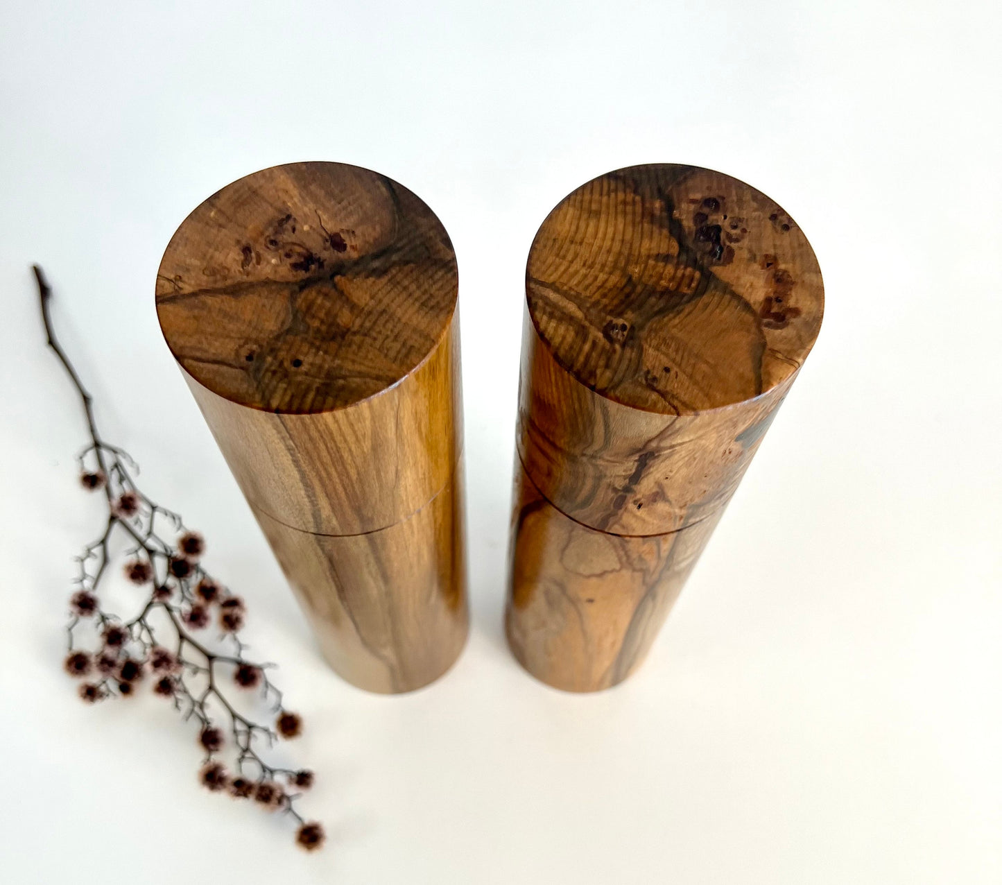 Birdseye view of wooden cylindrical shape salt and pepper grinders made from Australian Black Heart Sassafras timber