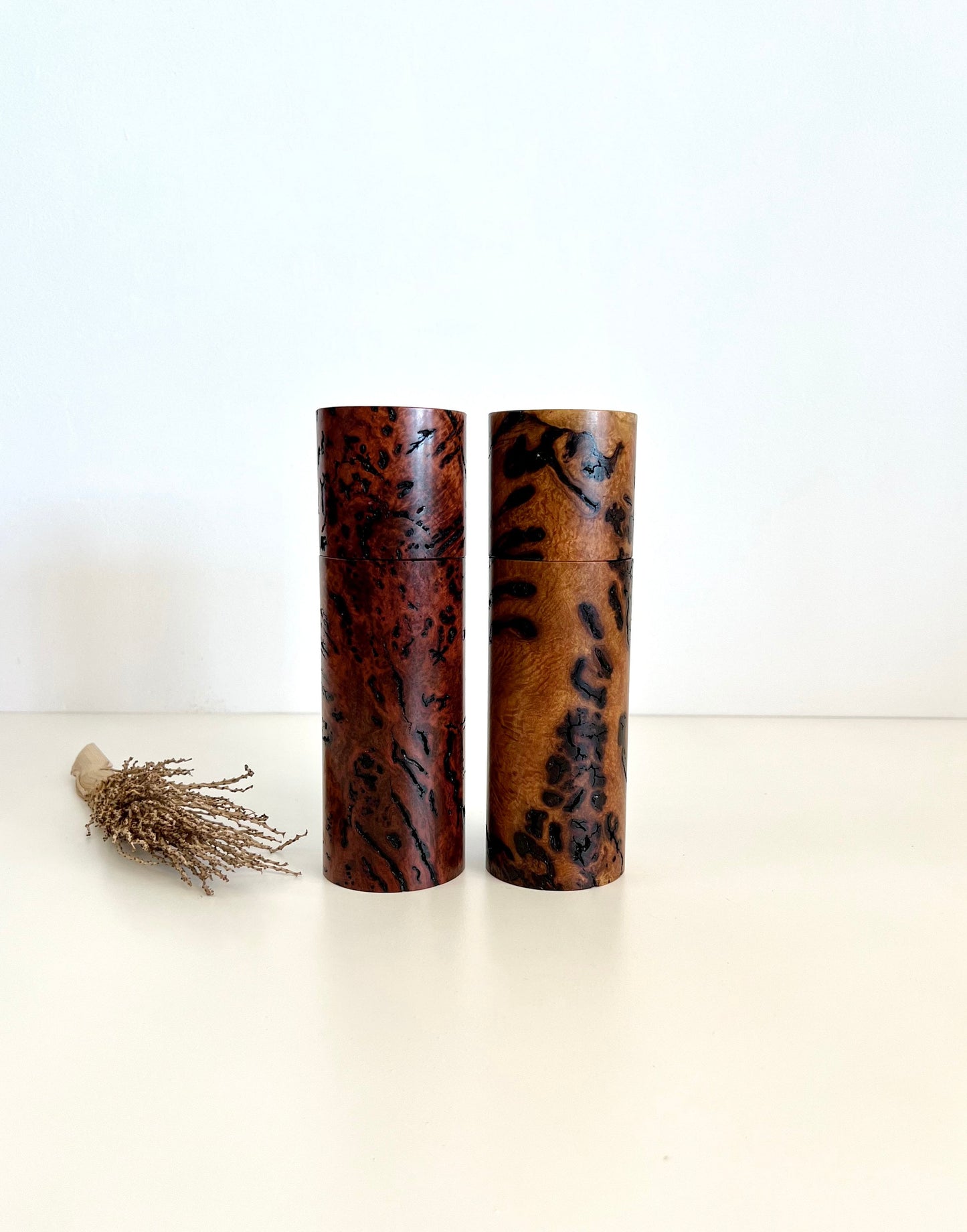 Wooden cylindrical shape salt and pepper grinders made from Australian Bimble box burl and salmon gum burl timbers