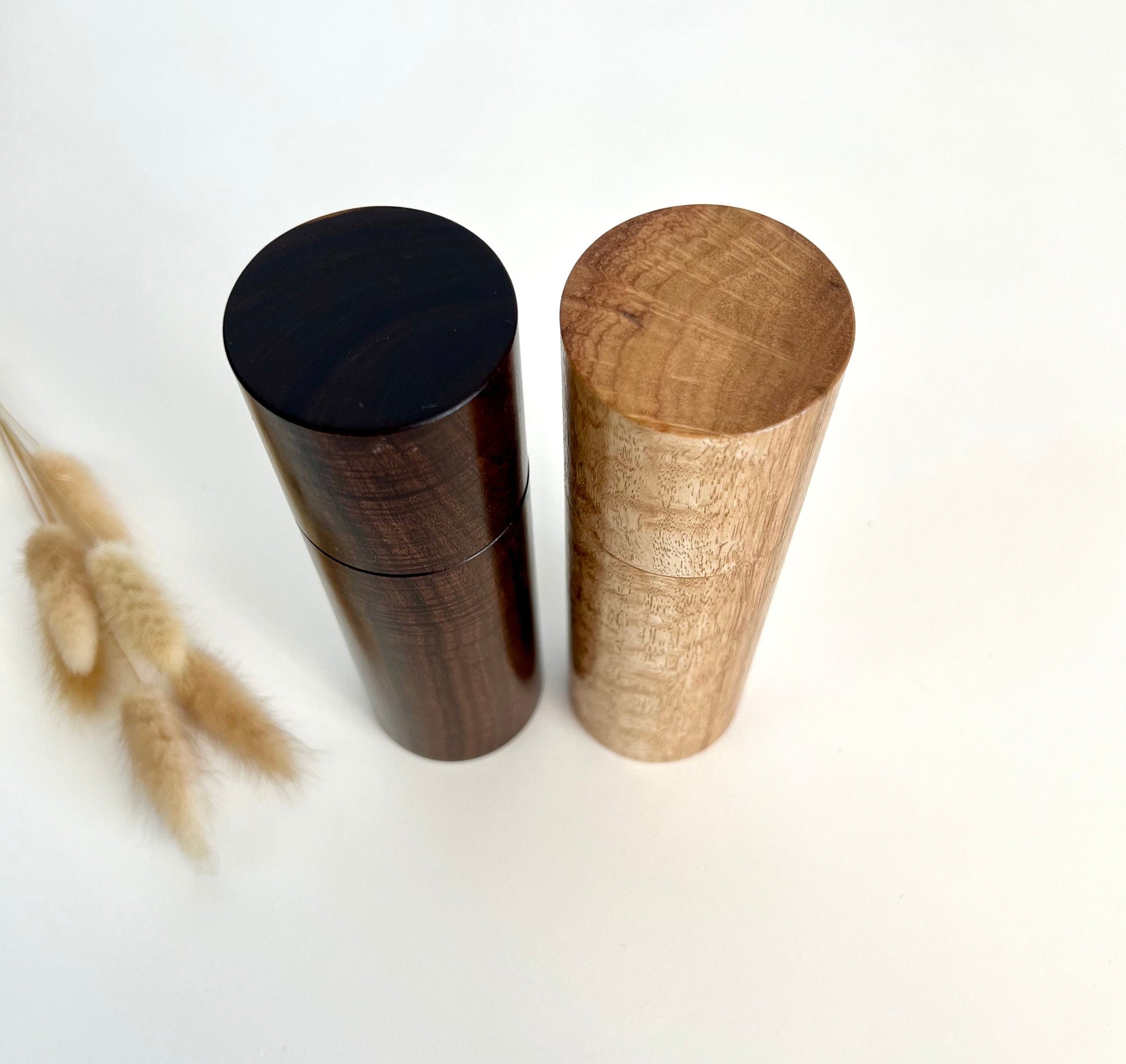 Birdseye view of wooden cylindrical shape salt and pepper grinders made from Australian Western Myall and bluegum timbers