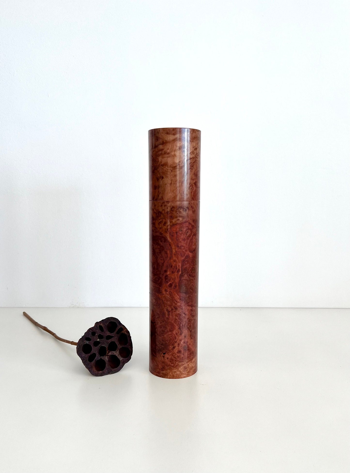 Wooden cylindrical shape salt and pepper grinder made from Australian Red Morrel burl timber