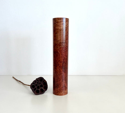 Wooden cylindrical shape salt and pepper grinder made from Australian Red Morrel burl timber