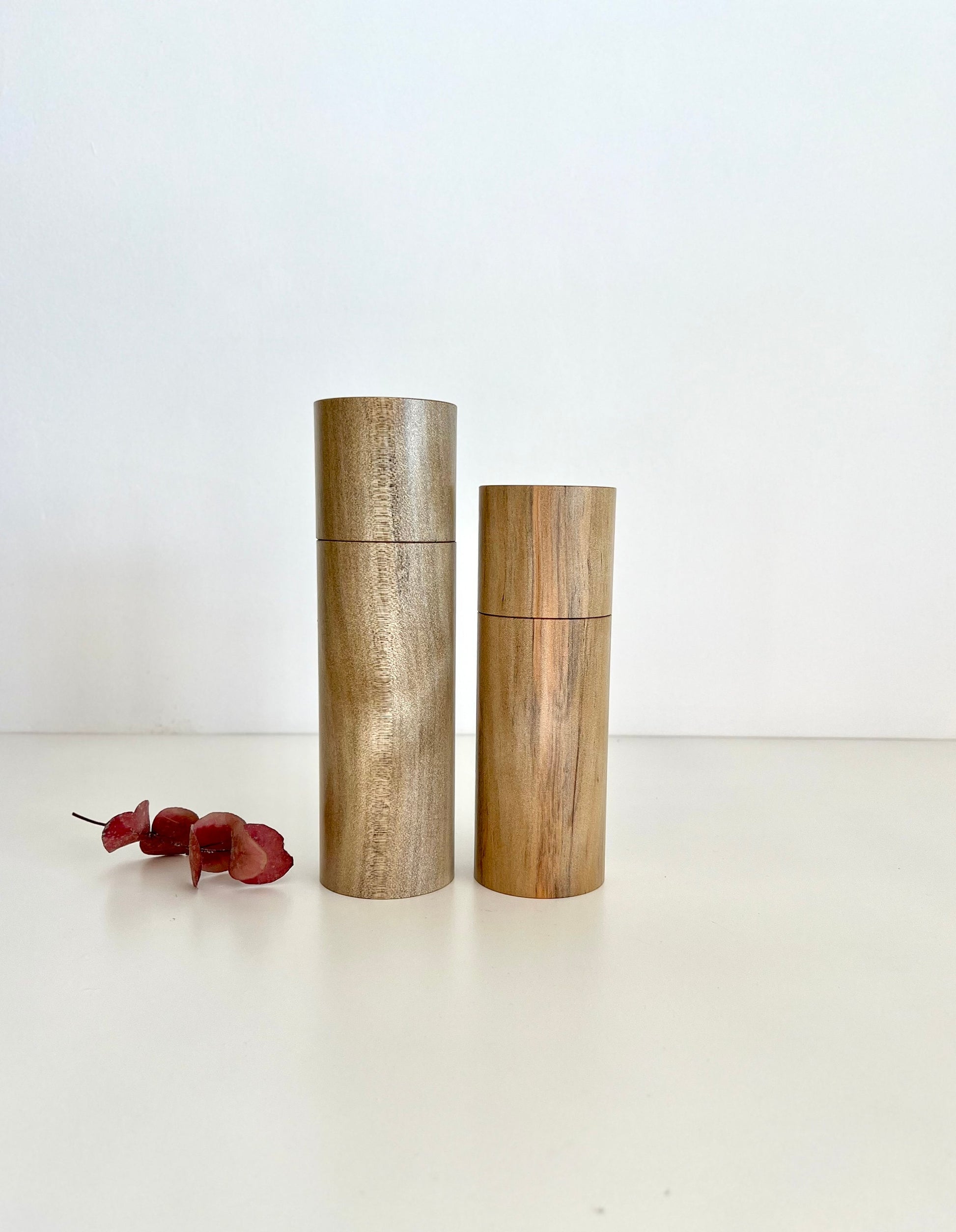 Wooden cylindrical shape salt and pepper grinders made from Norfolk Island Pine timber