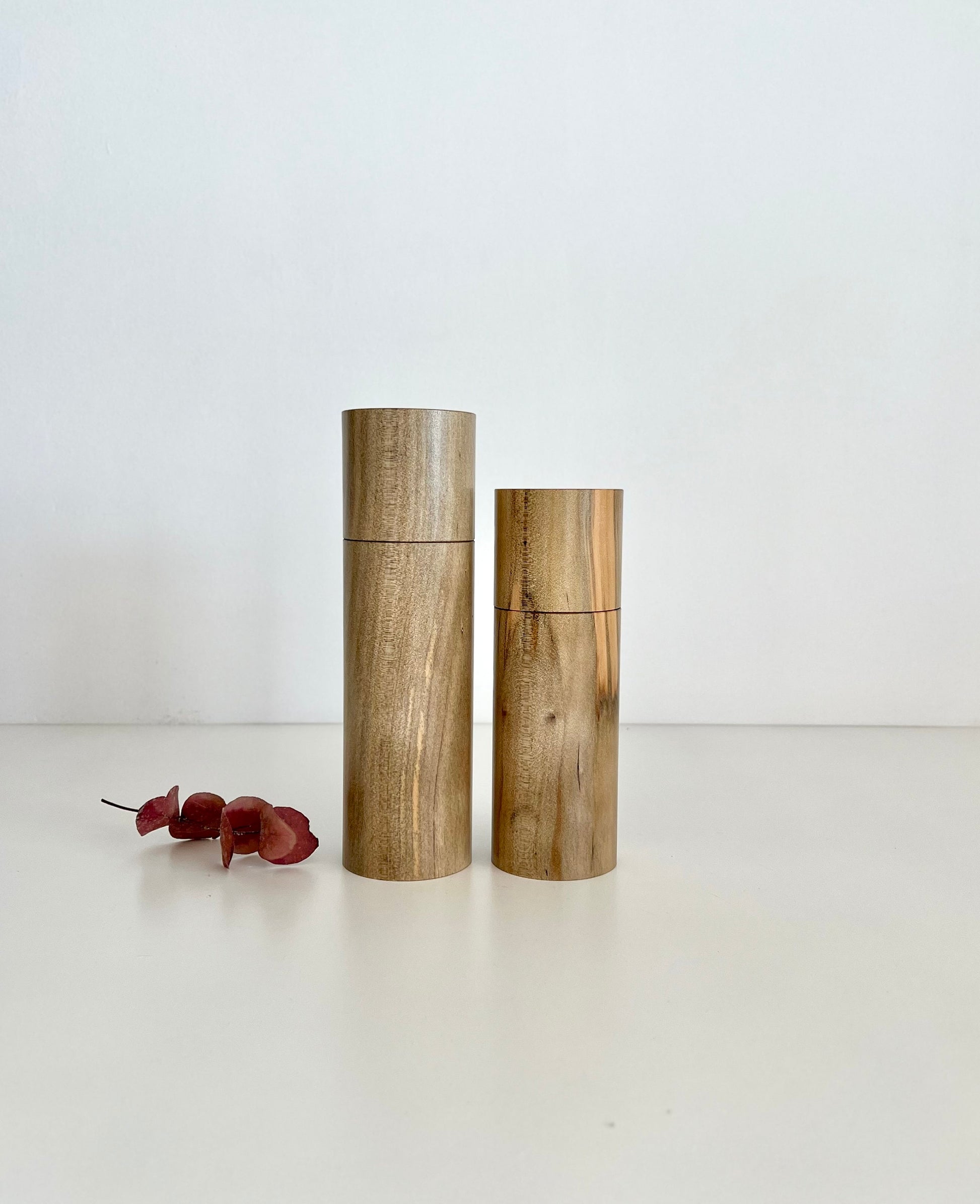 Wooden cylindrical shape salt and pepper grinders made from Norfolk Island Pine timber